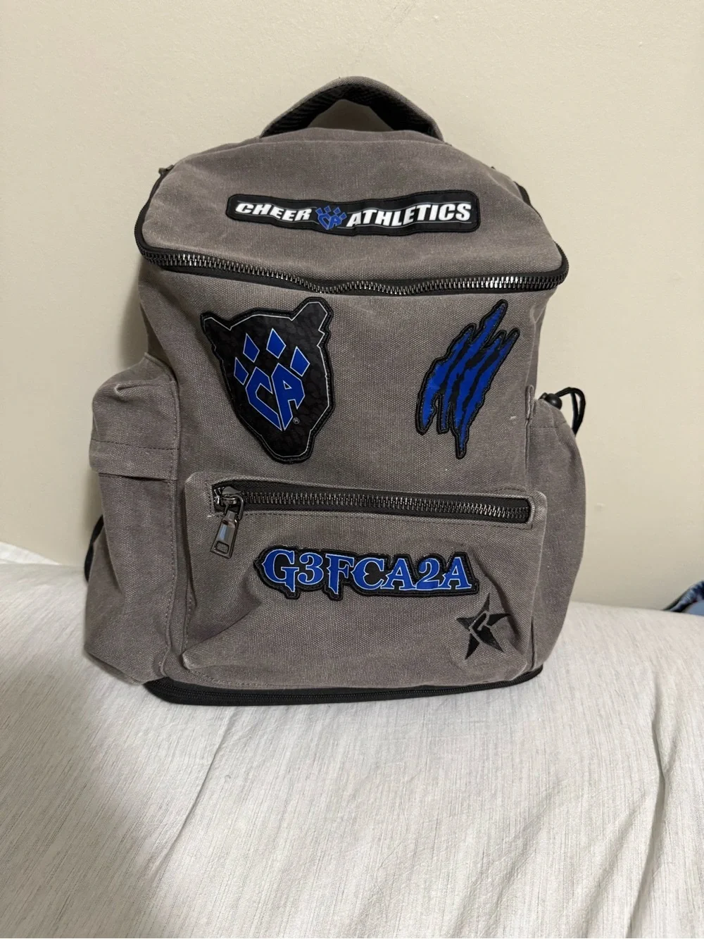 Gray Canvas Backpack with Blue Patches